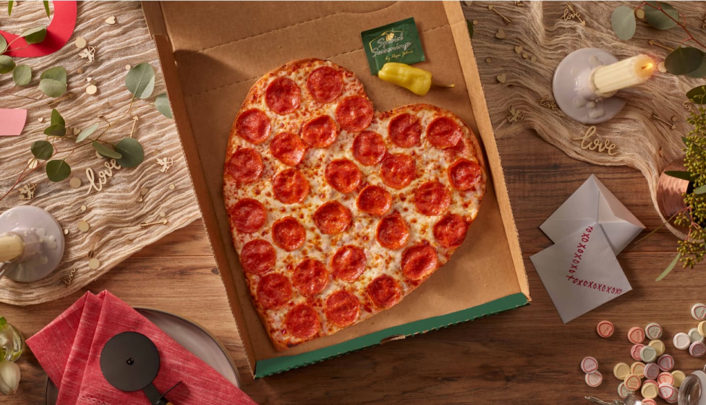 heart shaped pepperoni pizza in pizza box