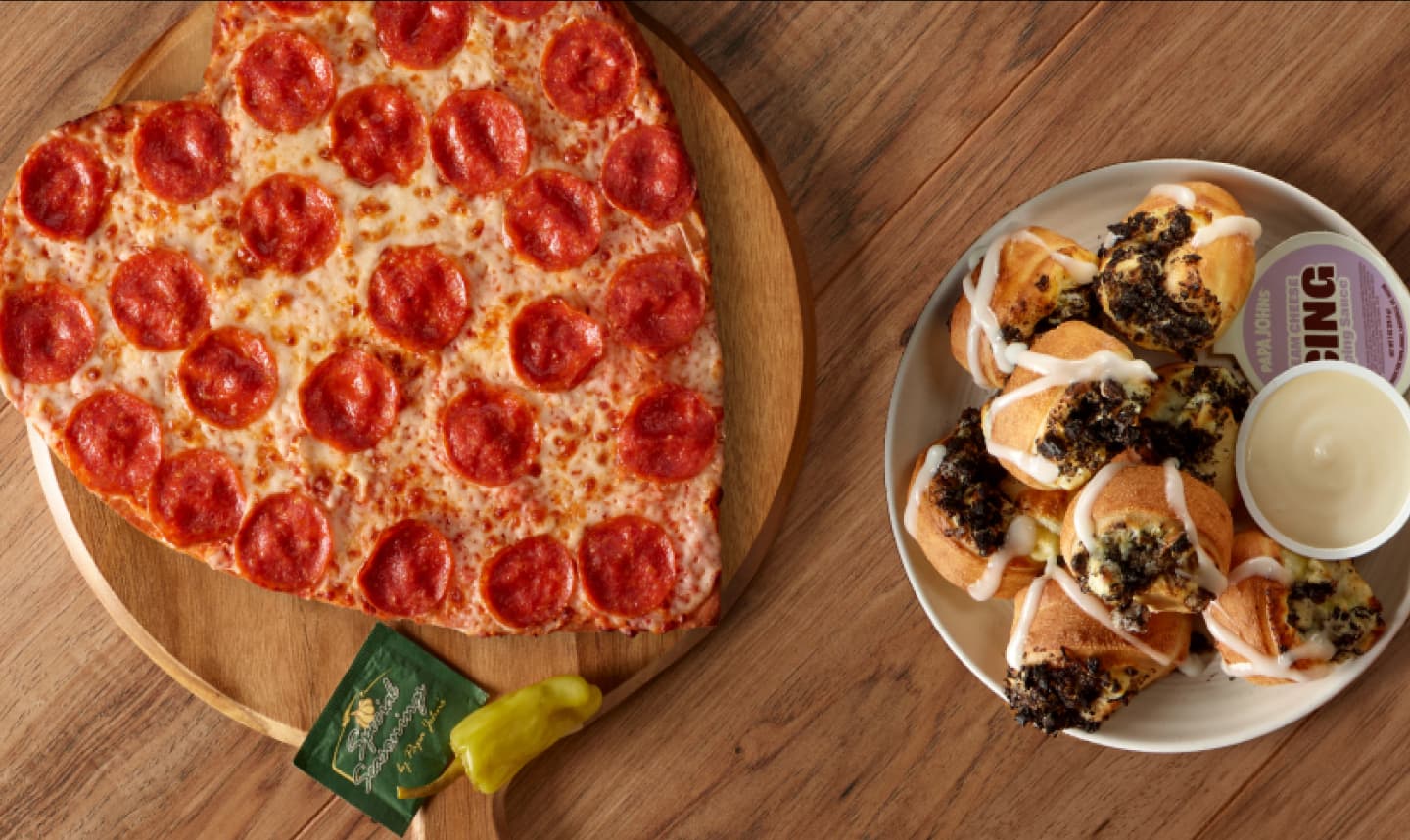 Papa Johns heart shaped pizza next to a plate of Oreo cookie papa bites