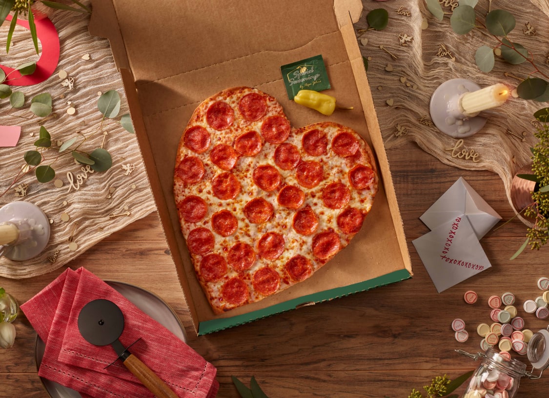 Heart-Shaped Pizza, The best way to your true love's heart... is through their stomach! Celebrate Valentine's Day with a thin crust Heart-Shaped Pizza. Nothing says "love" like a cheesy romantic dinner. Comes unsliced.